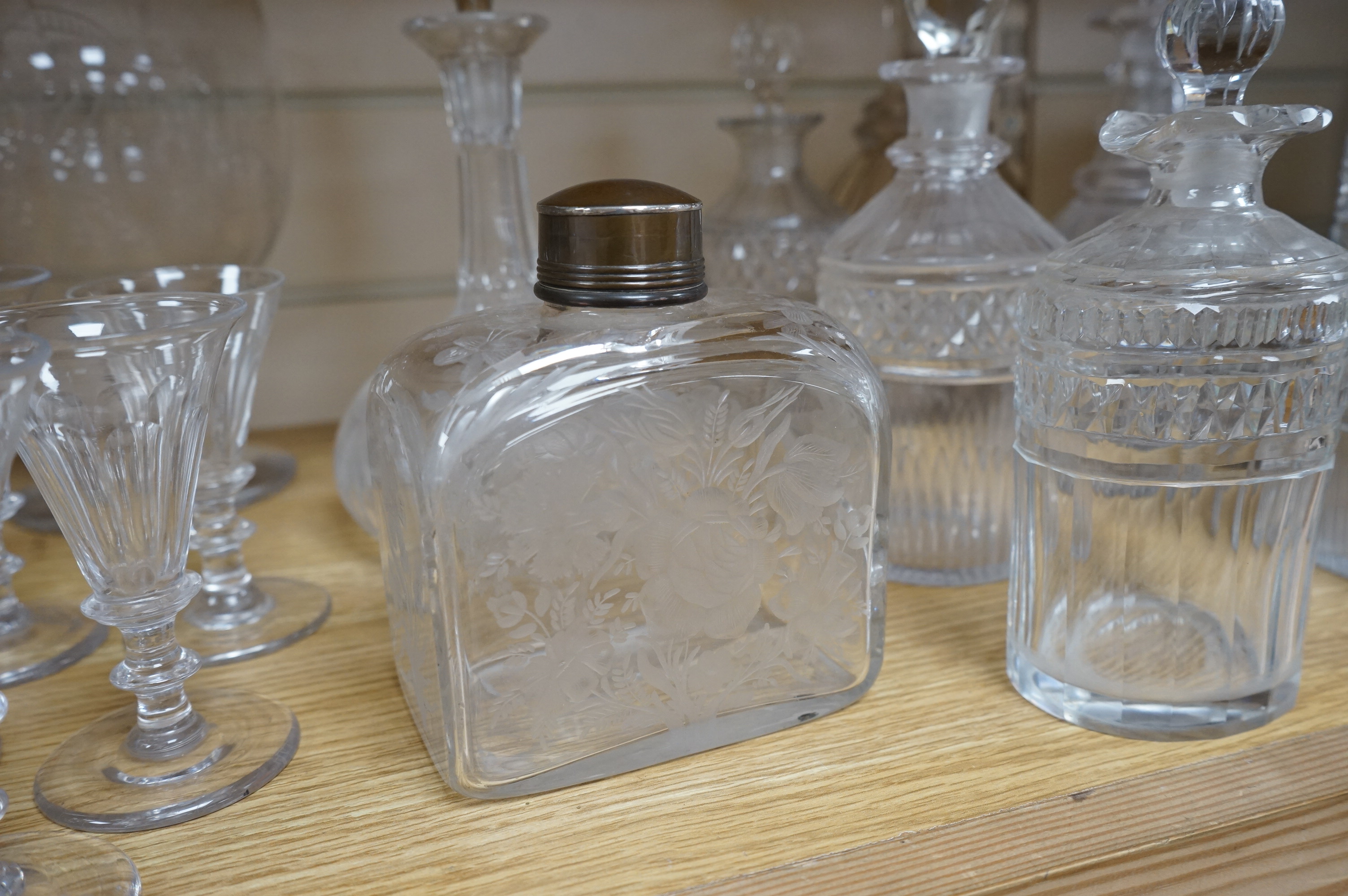 A collection of assorted drinking glassware including sets of decanters and a large etched glass goblet, largest 27cm high